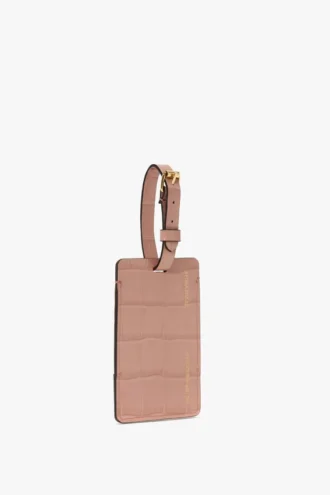 Bagasjelapp i rosa krokodillepreget skinn