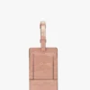 Bagasjelapp i rosa krokodillepreget skinn