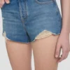 Distressed shorts i midtblå vask